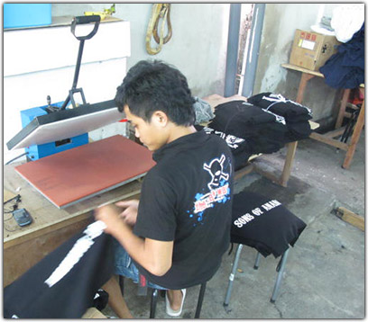 Heat pressing every print, so the ink sets